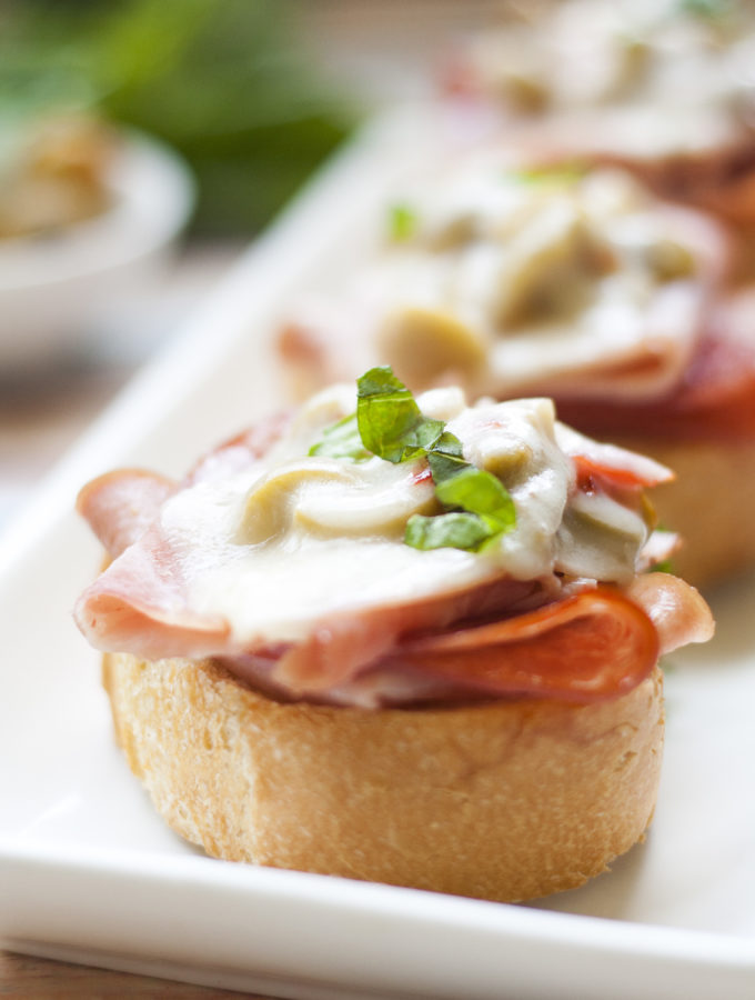 Melted Muffuletta Crostini